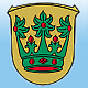 Die Geschichte der Wappen von Rodenbach - abgebildet ist das Rodenbacher Wappen, goldener Hintergrund mit einer gr&uuml;nen Bl&auml;tterkrone, verziert mit roten Steinen.